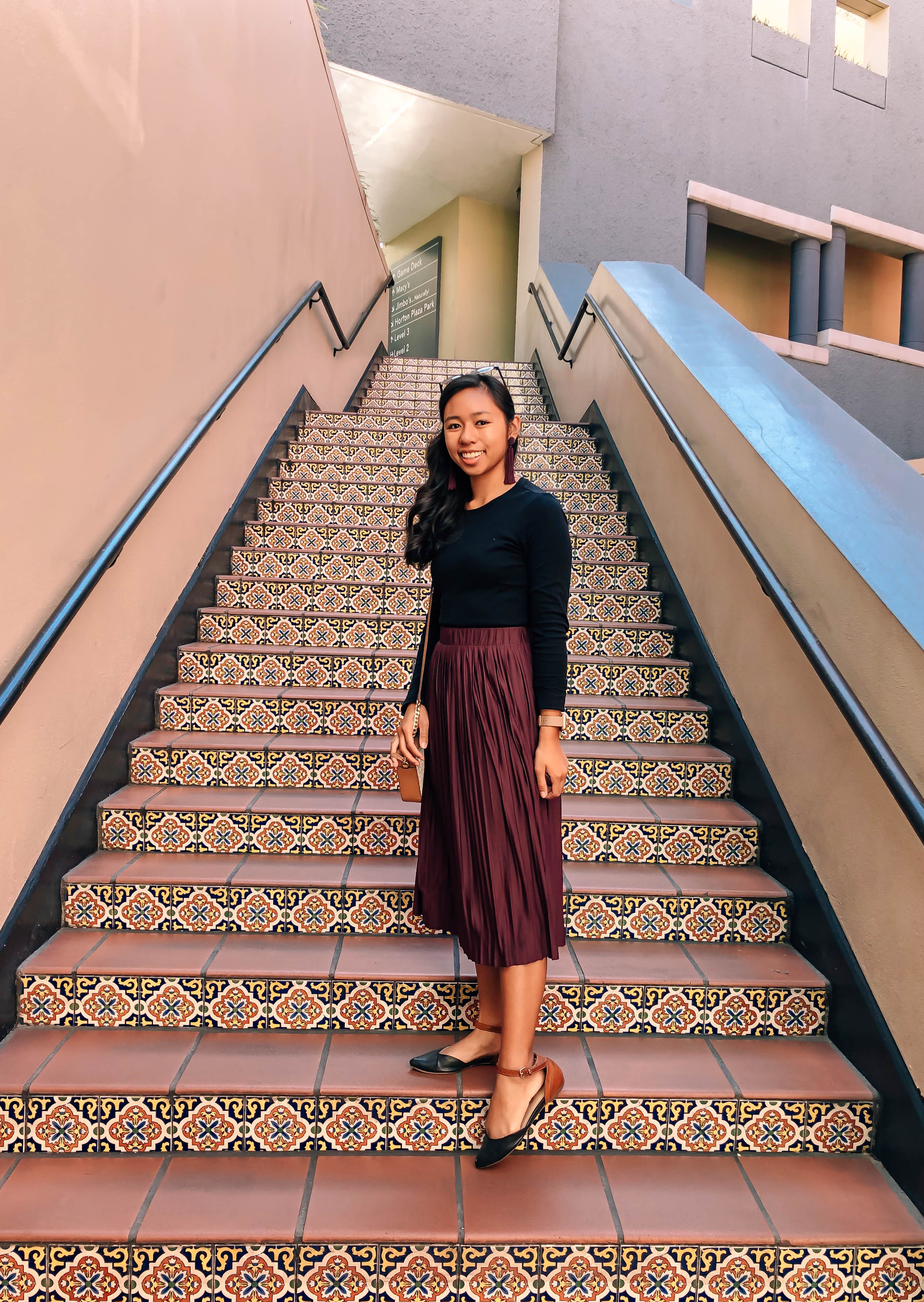 Holiday outfit with burgundy skirt and pointed flats
